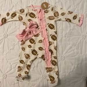 Mud Pie baby football print outfit with matching pink headband bow